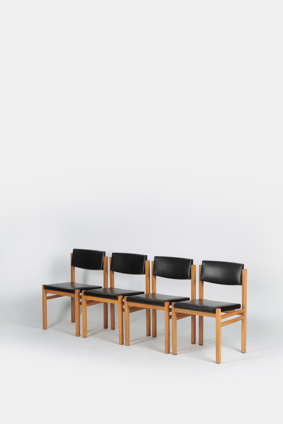 Set with 4 Hermann Baur chairs, oak and leather 60s