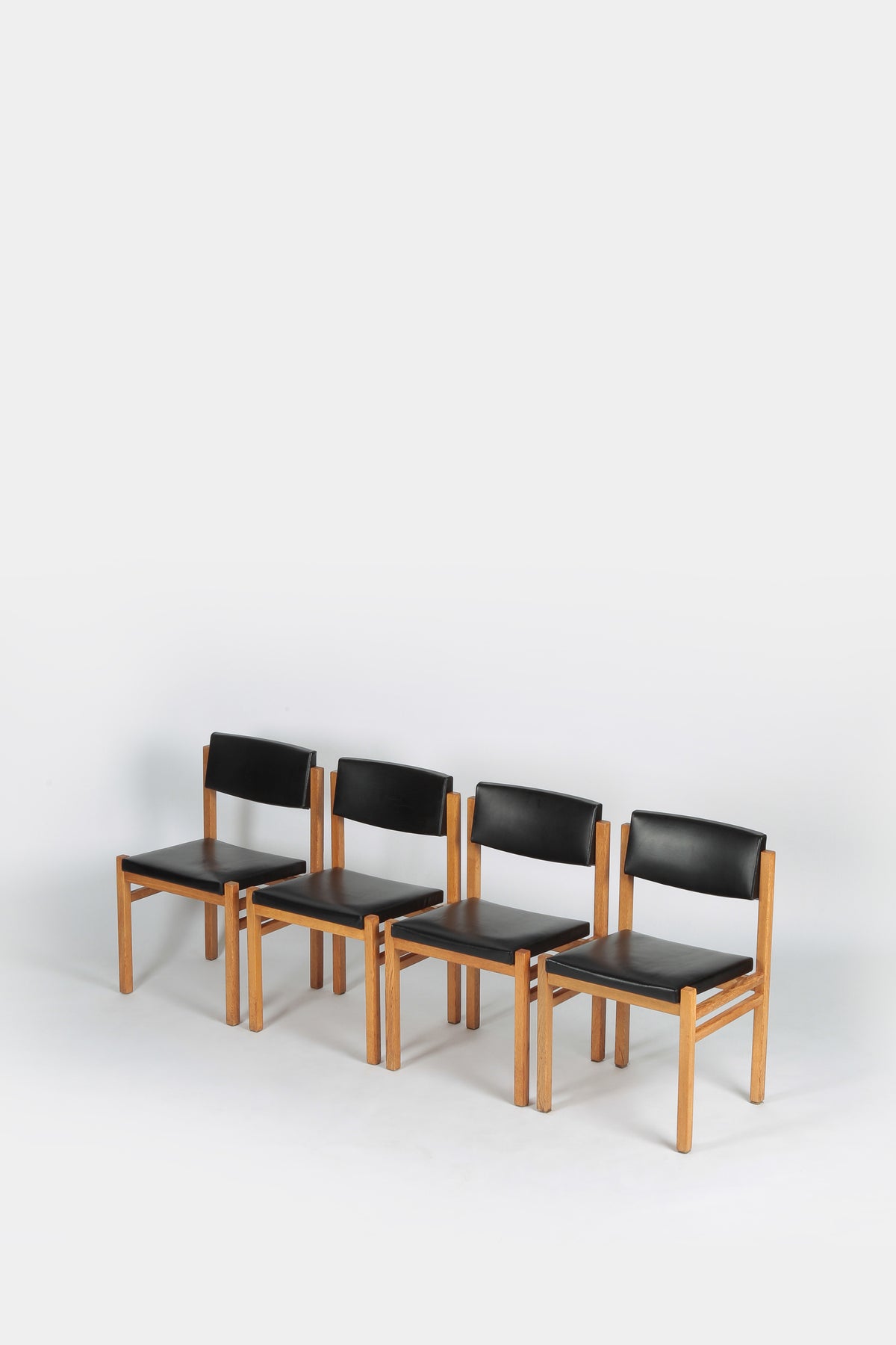 Set with 4 Hermann Baur chairs, oak and leather 60s